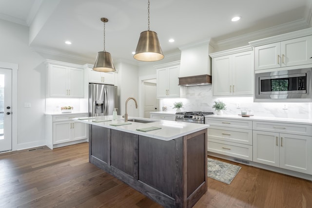 kitchen featuring appliances with stainless steel finishes, sink, custom exhaust hood, and white cabinets