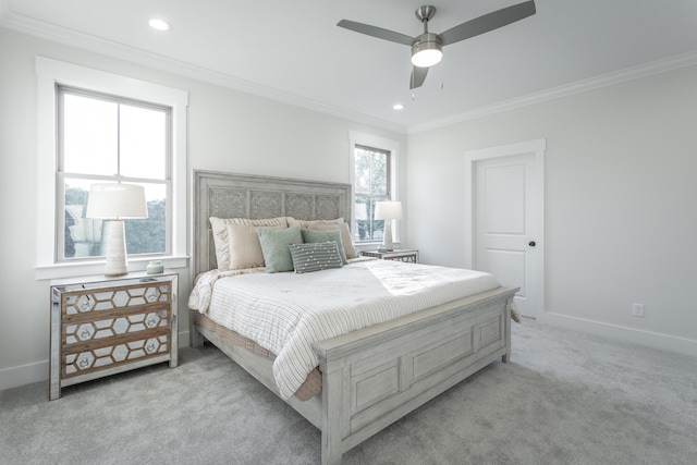 bedroom with crown molding, light colored carpet, and ceiling fan