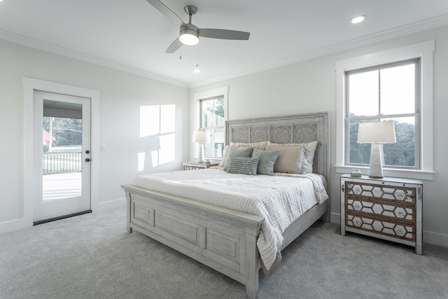 carpeted bedroom with multiple windows, ornamental molding, access to exterior, and ceiling fan