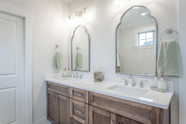 bathroom featuring vanity and crown molding