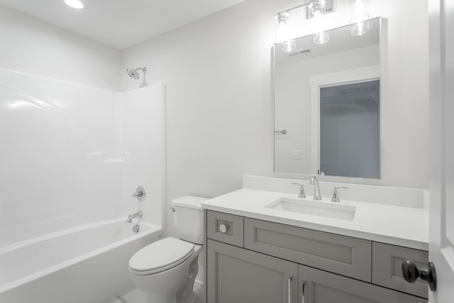 full bathroom featuring vanity, toilet, and bathing tub / shower combination