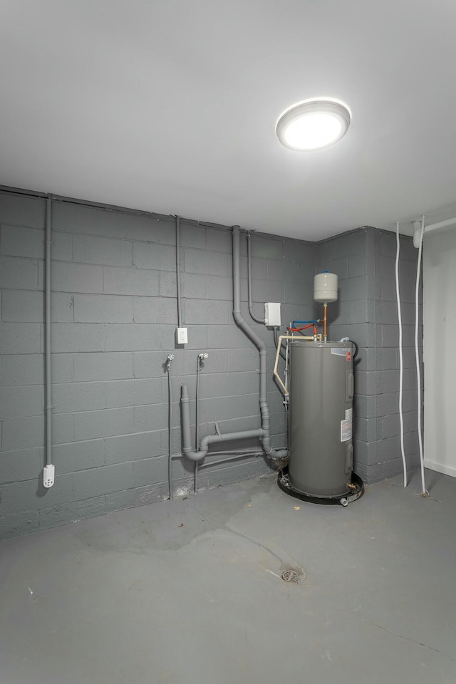 utility room featuring electric water heater