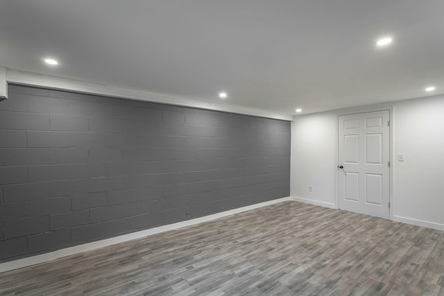 basement featuring hardwood / wood-style floors