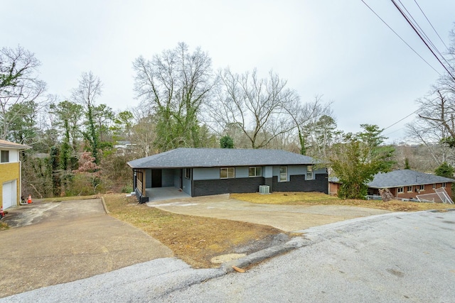 ranch-style house featuring a carport