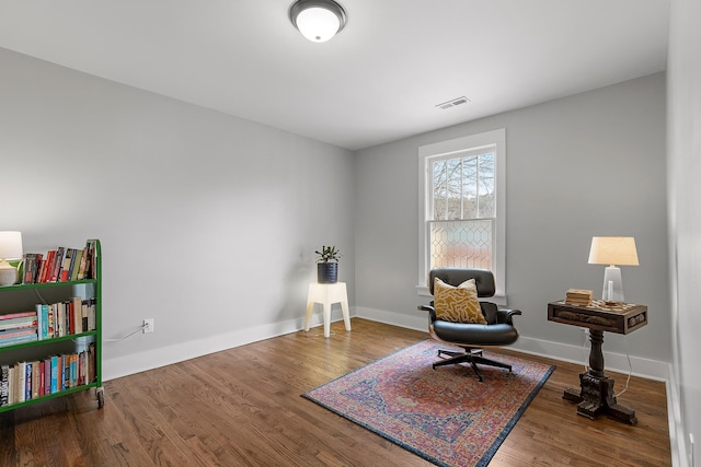 living area featuring hardwood / wood-style floors