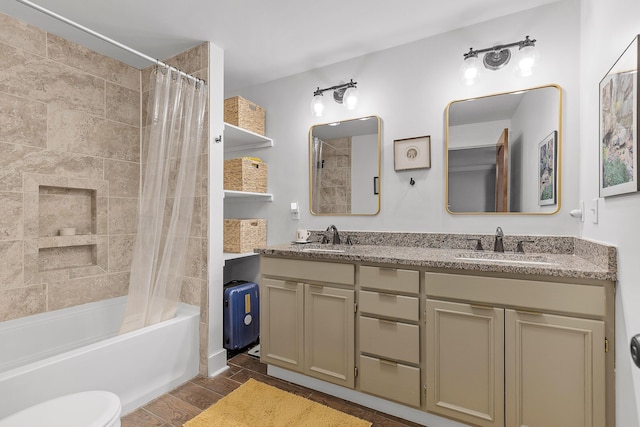 full bathroom featuring shower / bath combination with curtain, vanity, and toilet