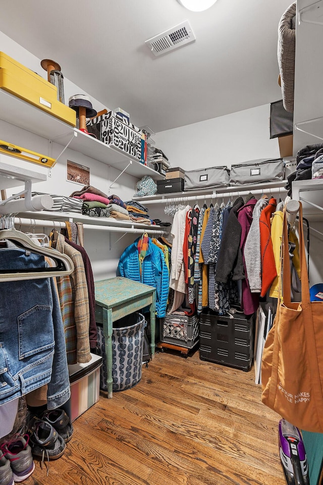 spacious closet featuring hardwood / wood-style flooring