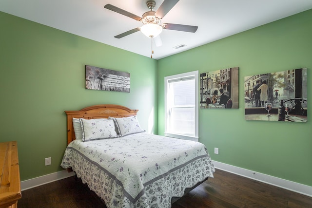 bedroom featuring dark hardwood / wood-style flooring and ceiling fan