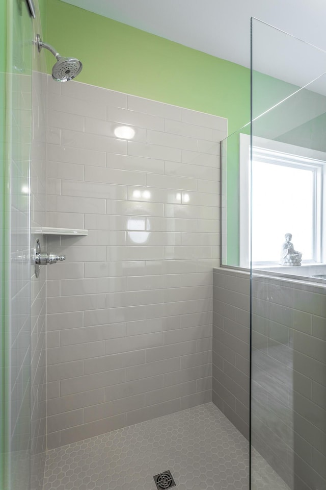 bathroom with tiled shower