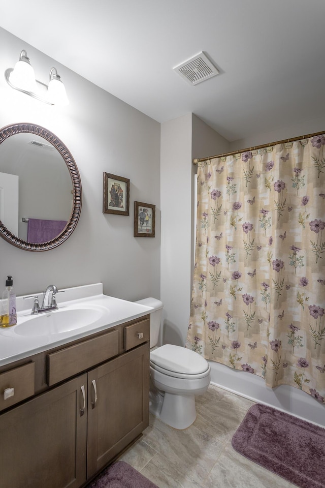 full bathroom featuring vanity, shower / bathtub combination with curtain, and toilet