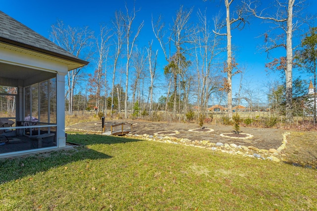 view of yard featuring a sunroom