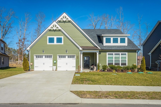 craftsman-style home featuring a garage and a front yard