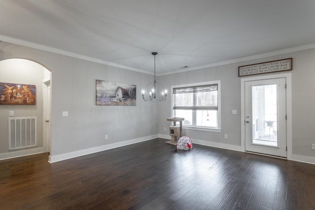 interior space featuring crown molding, dark hardwood / wood-style flooring, and a chandelier