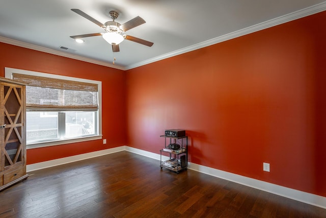 unfurnished room featuring dark wood-type flooring, ornamental molding, and ceiling fan