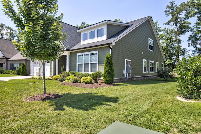 1502 Buttonwood Loop, Chattanooga, TN 37421 - view of front facade with a garage, a front yard, concrete driveway, and a shingled roof