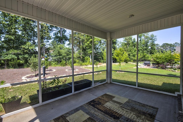 1502 Buttonwood Loop, Chattanooga, TN 37421 - unfurnished sunroom featuring view of wooded area