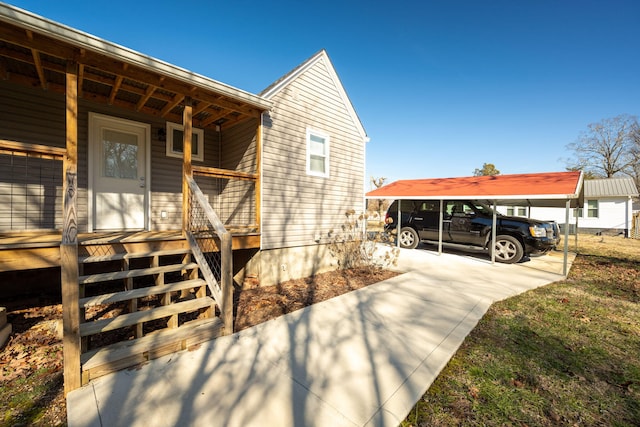 view of home's exterior with a carport