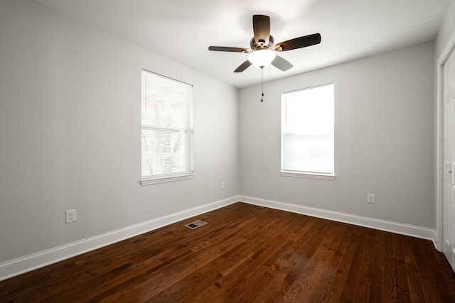 unfurnished room with dark wood-type flooring and ceiling fan