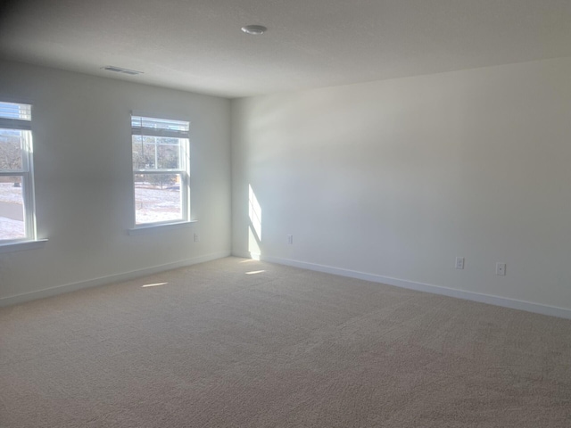 empty room featuring carpet floors