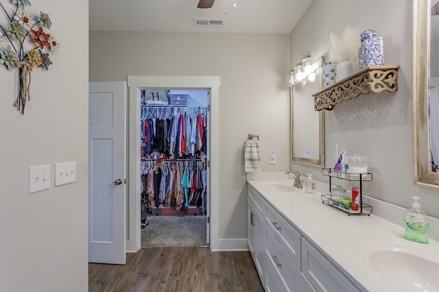 bathroom with vanity, wood-type flooring, and ceiling fan