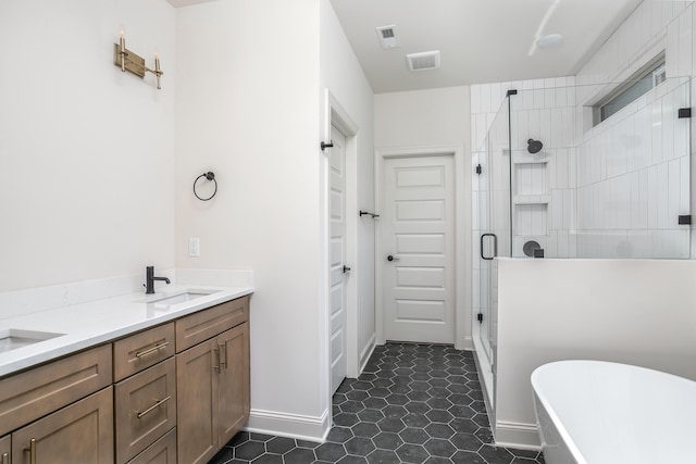 bathroom with vanity, separate shower and tub, and tile patterned floors