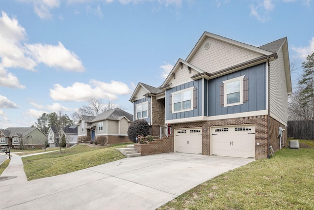 view of front of house with a garage, central AC, and a front lawn