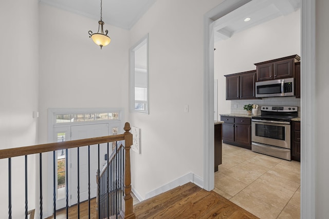 hallway with light hardwood / wood-style floors