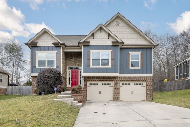 view of front of property featuring a garage and a front yard