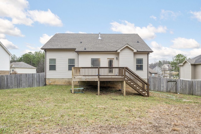 back of property featuring a yard and a deck