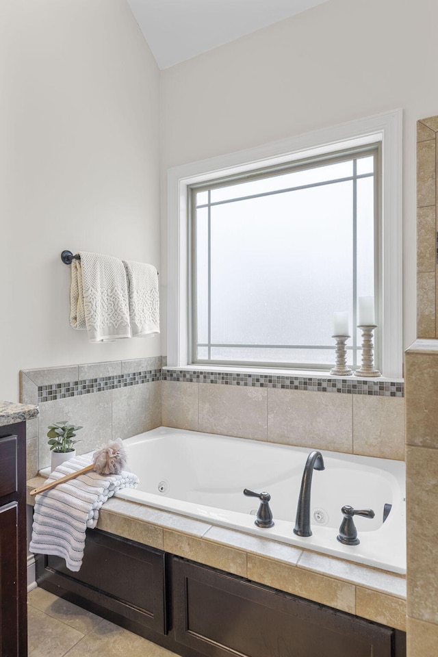 bathroom featuring a relaxing tiled tub