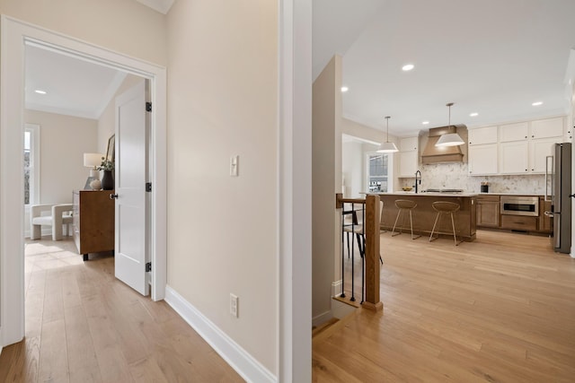 hall with light wood-type flooring