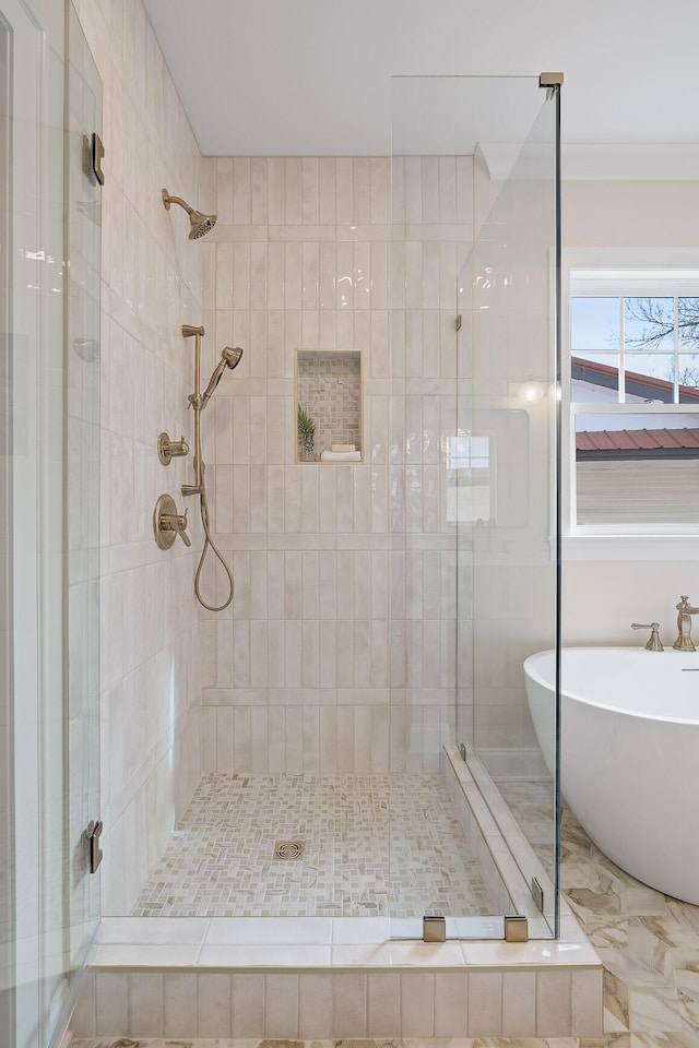 bathroom with crown molding and shower with separate bathtub