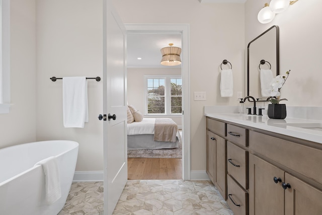 bathroom featuring vanity and a bath