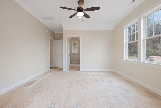 spare room with ceiling fan, ornamental molding, and a wealth of natural light