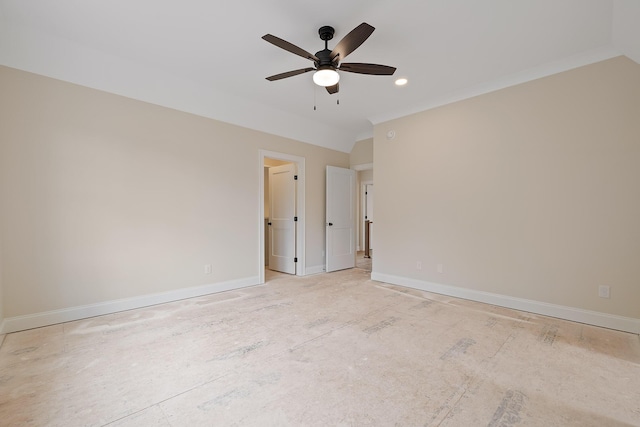 empty room with ornamental molding and ceiling fan