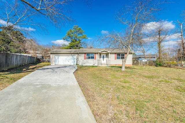 ranch-style home with a garage and a front lawn