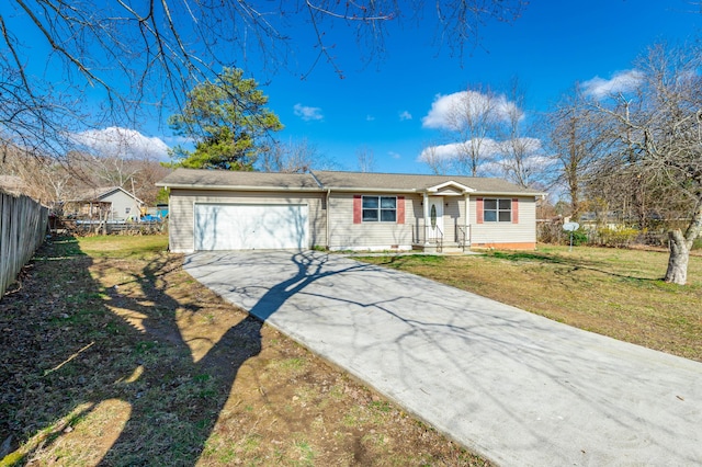 ranch-style home with a garage and a front yard