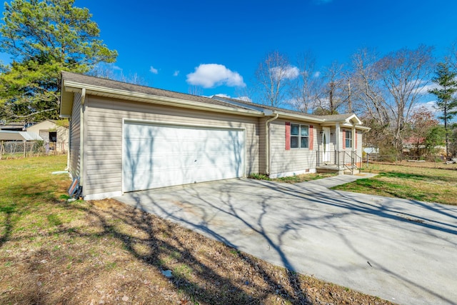 view of front of property with a garage and a front yard