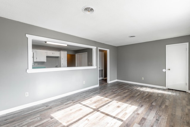 empty room featuring wood-type flooring