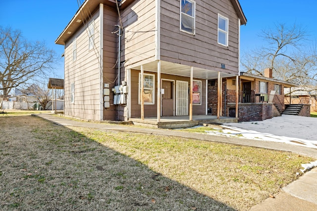 exterior space with a front yard and covered porch