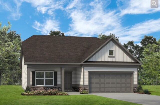 view of front facade featuring a garage and a front lawn