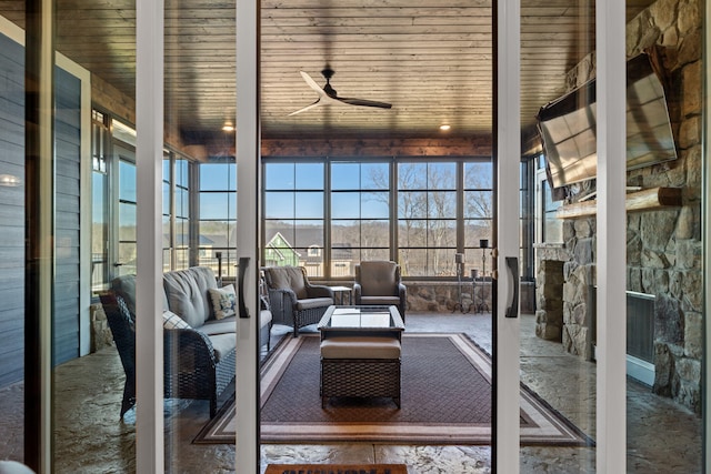 unfurnished living room with wooden ceiling and ceiling fan