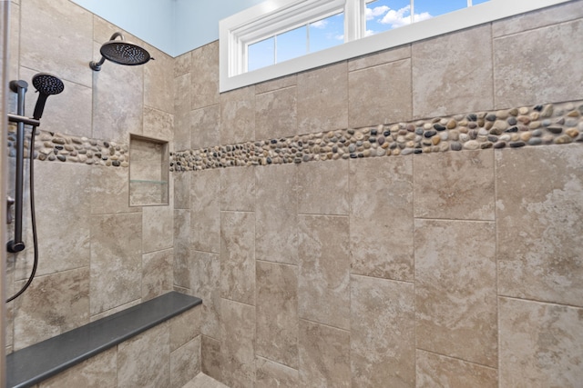 bathroom featuring tiled shower