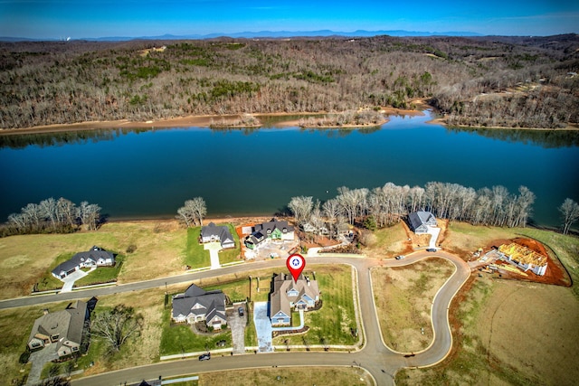 birds eye view of property with a water view