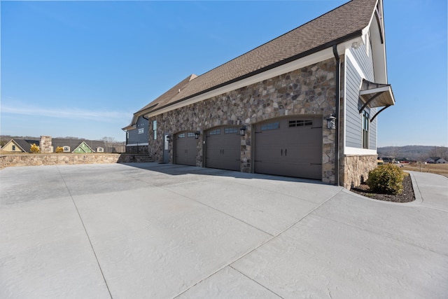 view of side of property featuring a garage