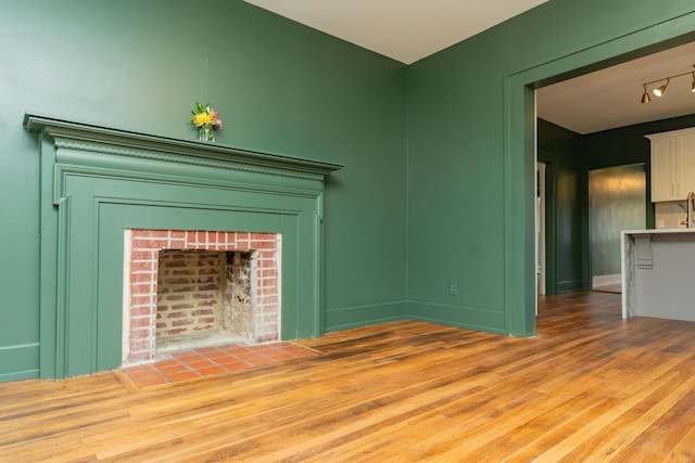 unfurnished living room with light hardwood / wood-style floors