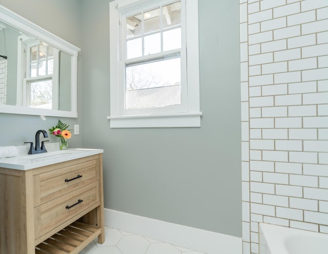 bathroom with tile patterned floors, vanity, and tub / shower combination