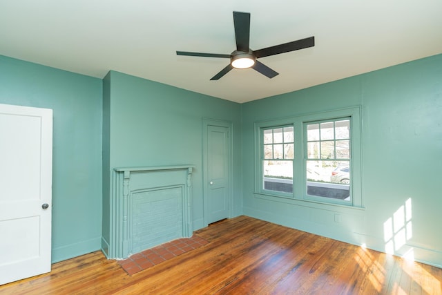 unfurnished room featuring hardwood / wood-style floors and ceiling fan