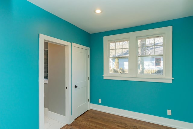 unfurnished bedroom featuring wood-type flooring