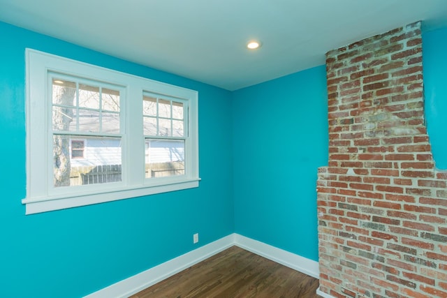 empty room featuring wood-type flooring